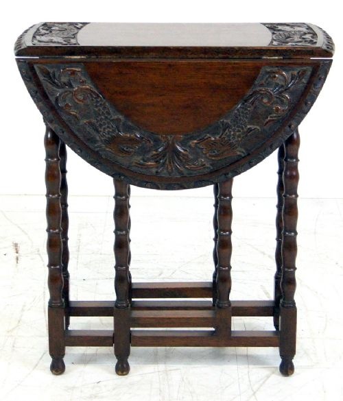 A Small Carved Oak Gateleg Table