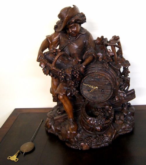 A Rare, Exceptional Swiss Black Forest Carved Clock
