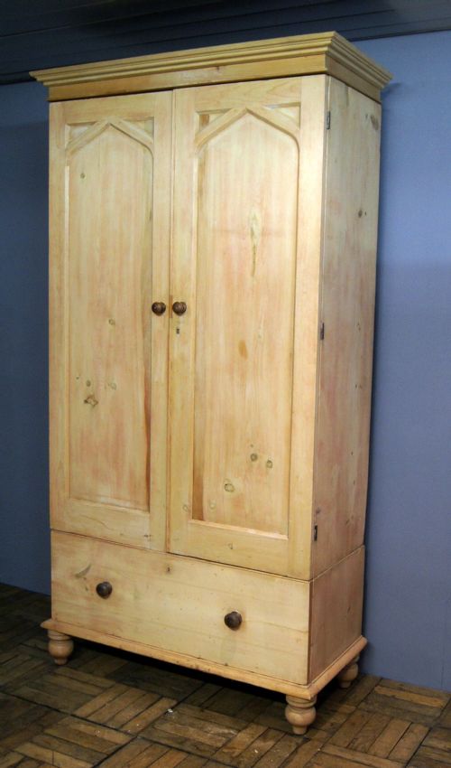 A Stripped Pine Wardrobe with Gothic Influence