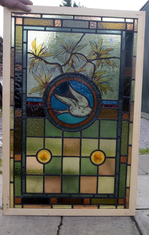 A Stunning Leaded Glass and Painted Window of a Bird in Flight
