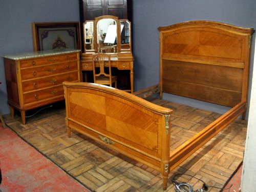 A Majestic Satin Wood Suite of French Bedroom Furniture