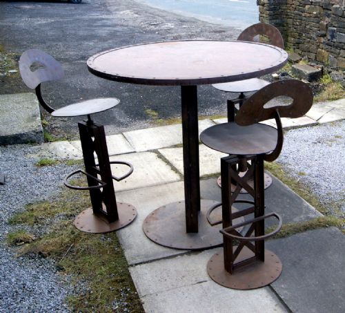 AN INDUSTRIAL FRENCH BISTRO TABLE AND CHAIRS - ADDITIONAL PHOTO 1