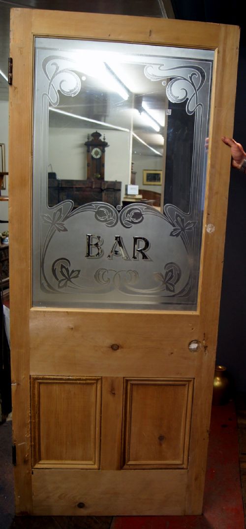 A Good Plate Glass Cut and Etched Bar Door