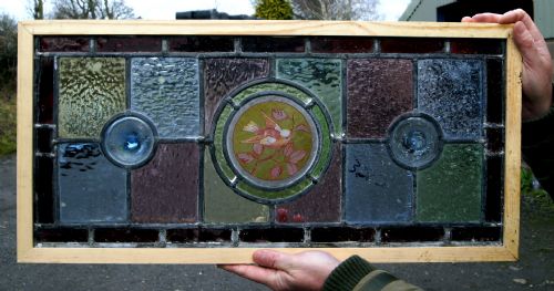 A Vibrant Stained Glass Painted Bird Window