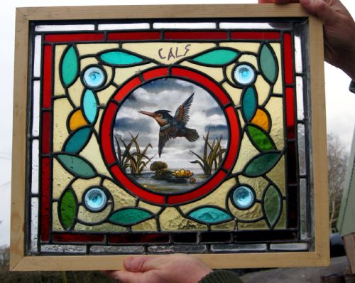 A Vibrant Stained Glass Painted Bird Window