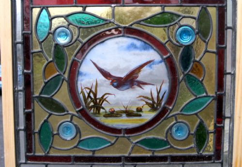 A Stunning Stained Glass Window with a Painted Bird Centre