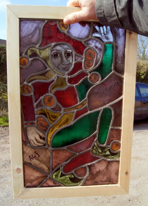A Flemish Arts and Crafts Style Painted Leaded Glass Window