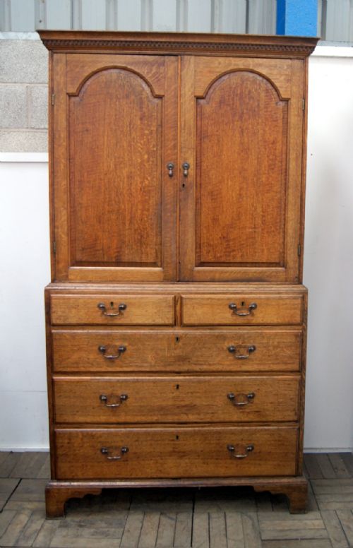 A Charming Pale Oak Country Cupboard on Chest