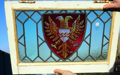 A Good Painted Window of a Double Headed Eagle in a Shield