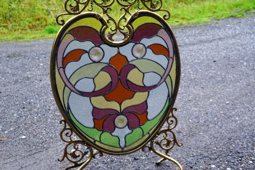 A Stunning Art Nouveau Brass and Leaded Glass Fire Screen
