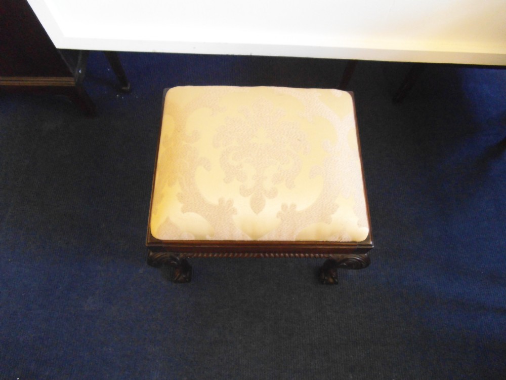 Mahogany claw and ball stool.