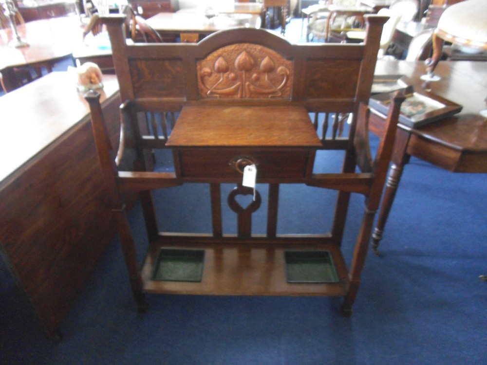 Arts and crafts stick stand, by Shapland and Petter.