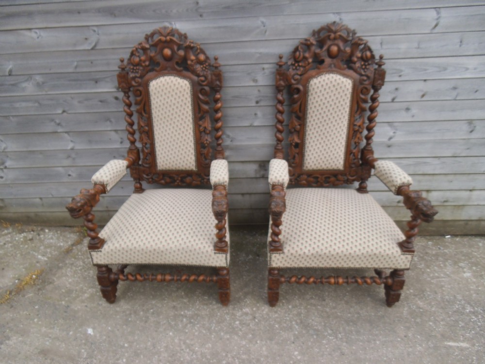 Pair of carved oak barley twist arm chairs
