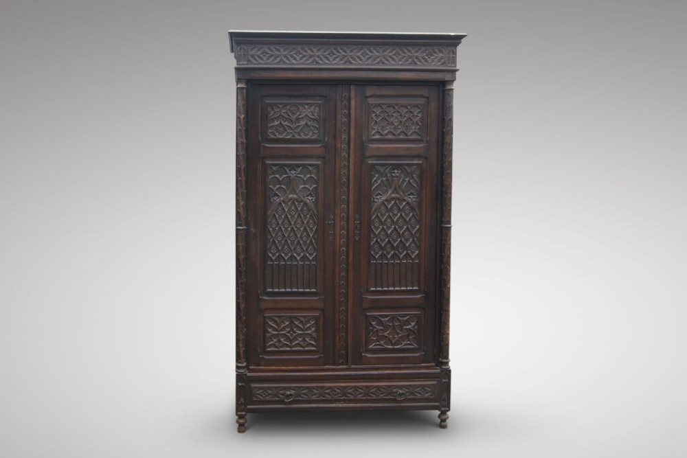 A fabulous gothic oak cupboard