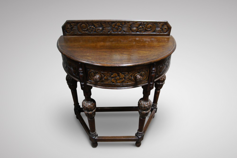 Fantastic carved oak demi lune side table