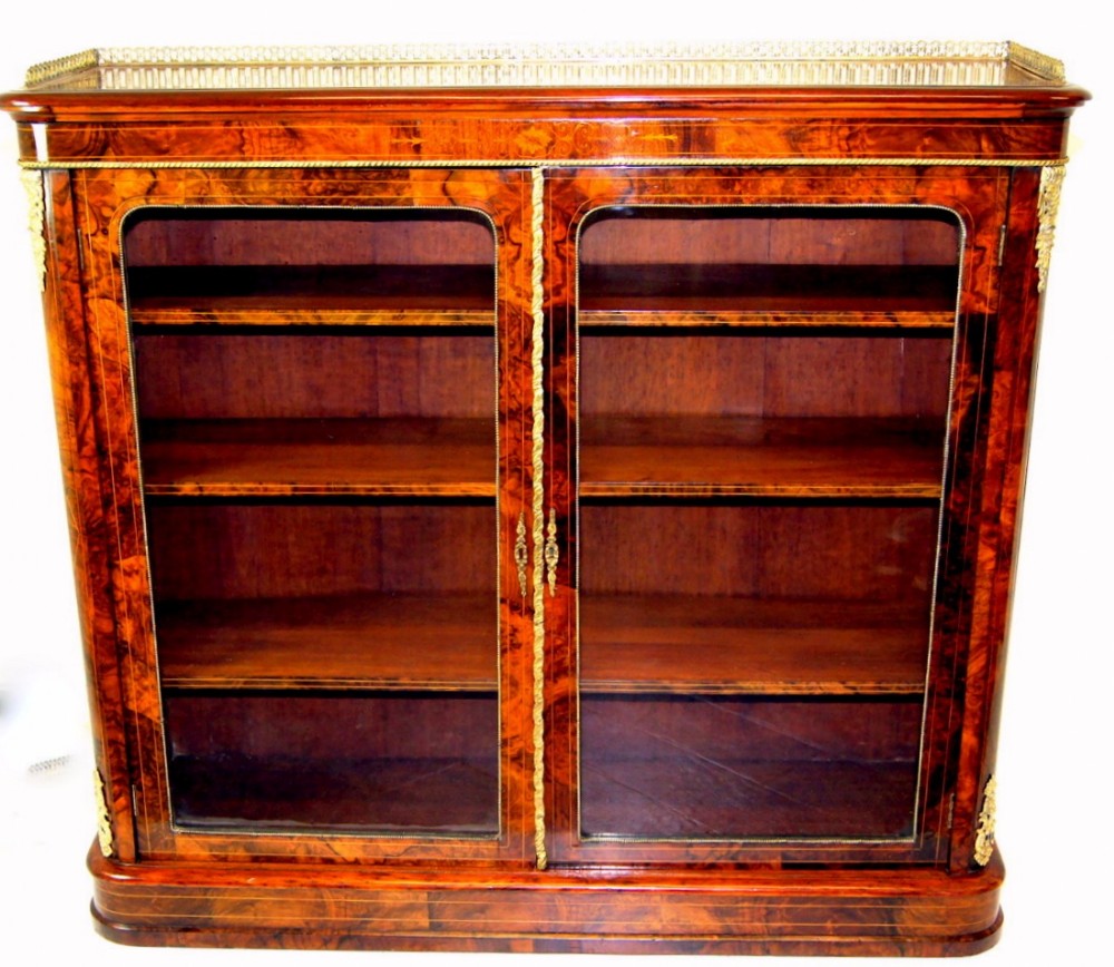 A fine burr walnut Victorian inlaid bookcase