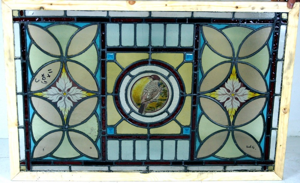 One of four wonderful painted bird windows