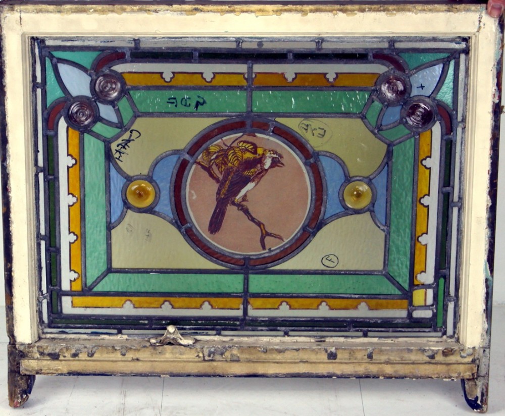 A good well painted leaded glass bird window