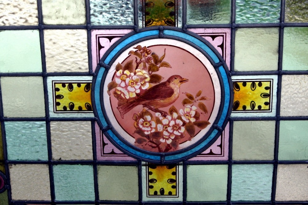 A magnificent painted Victorian bird window