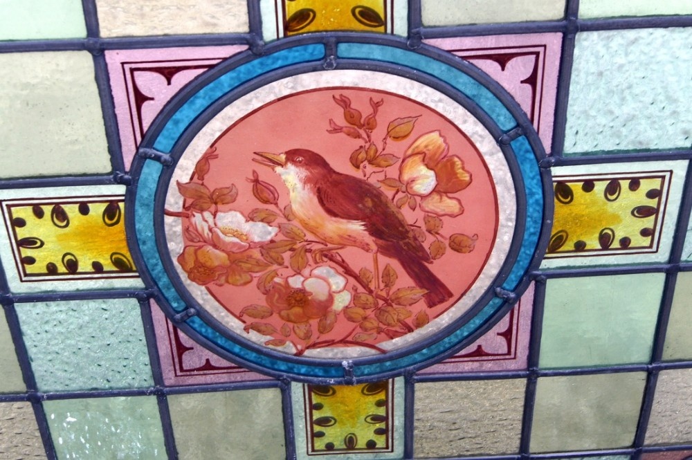 A magnificent painted Victorian bird window