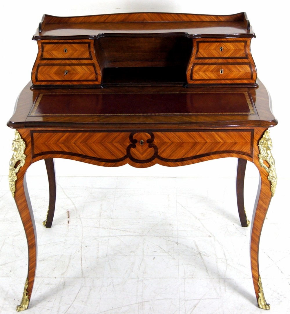 A great Kings wood French leather topped desk