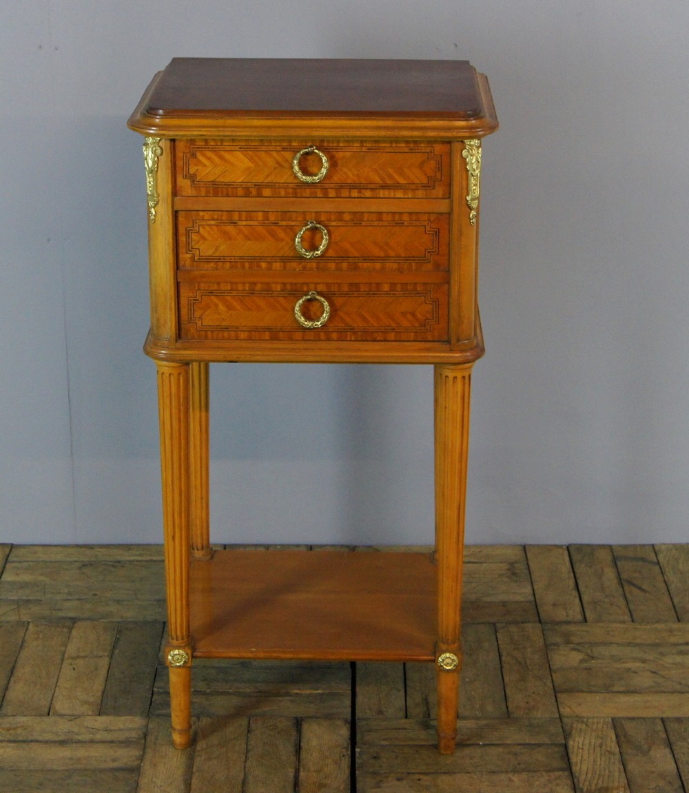 A small satin wood inlaid chest