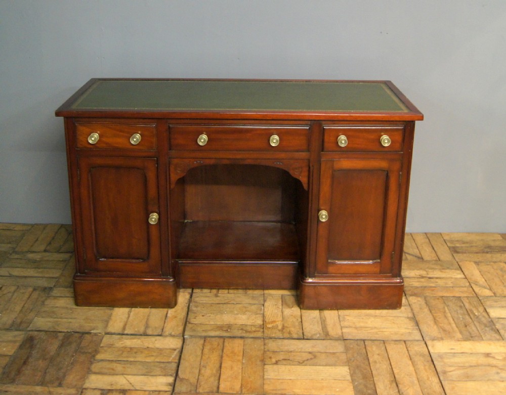 A Victorian mahogany leather topped desk 