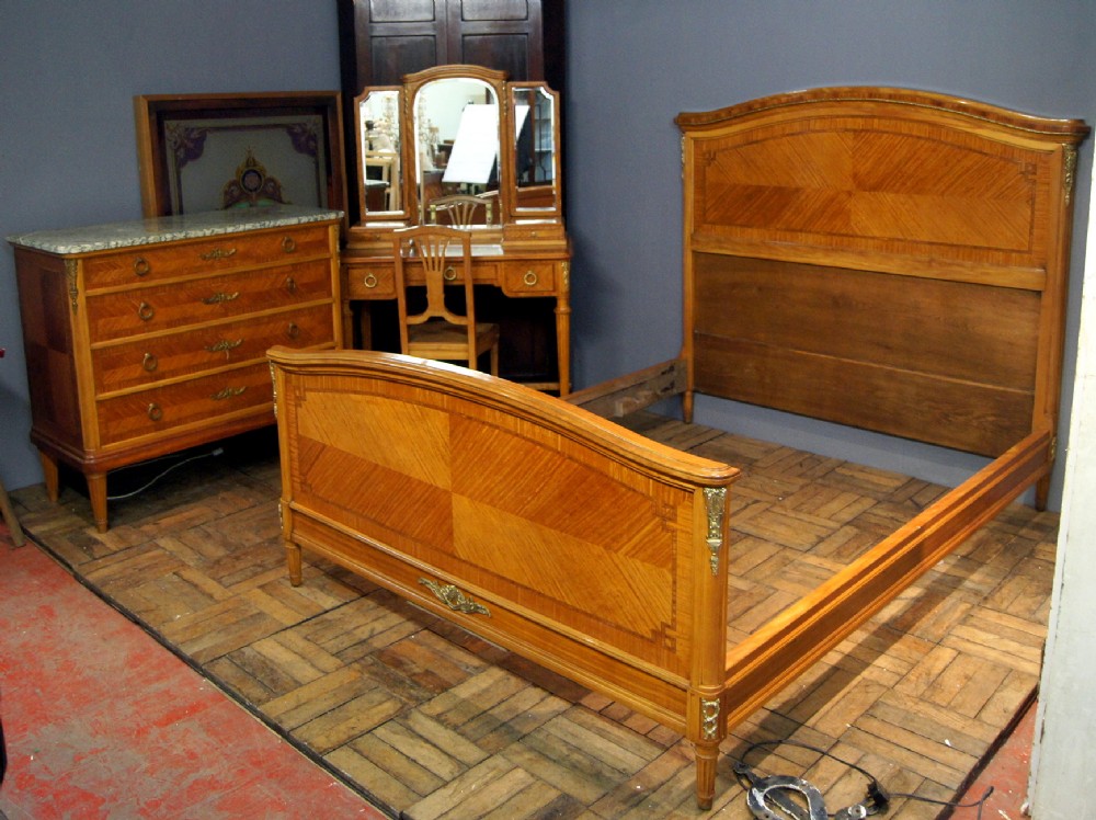 A Majestic Satin wood suite of French bedroom furniture