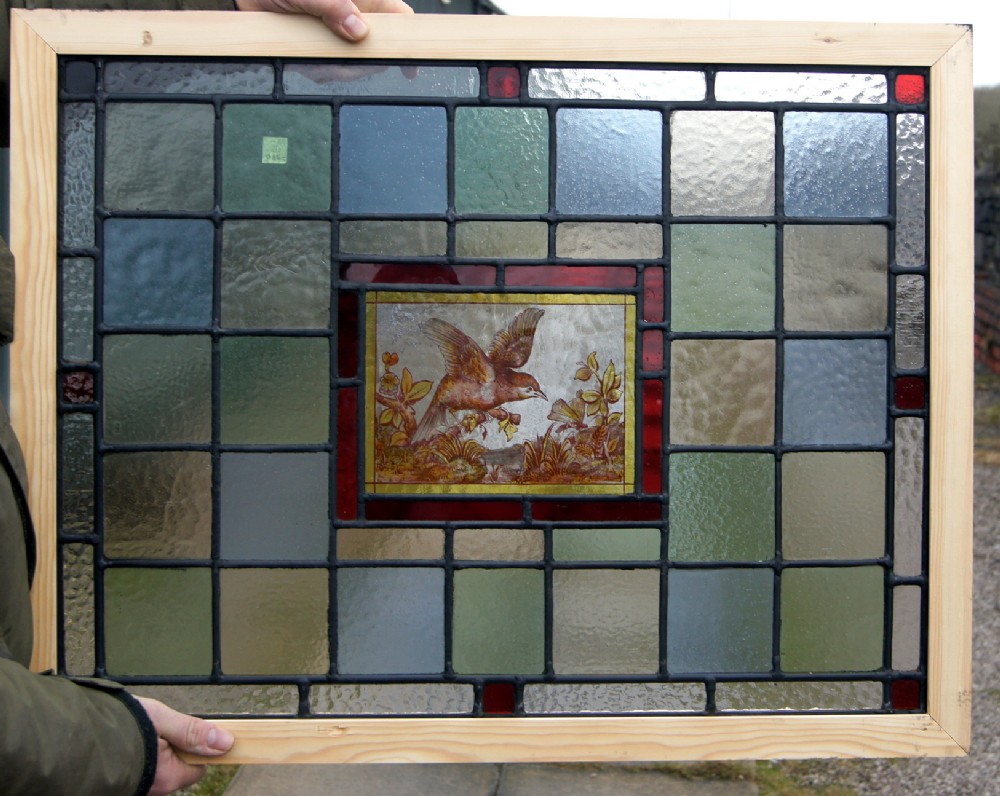 A great pair of bird windows with oblong painted panels