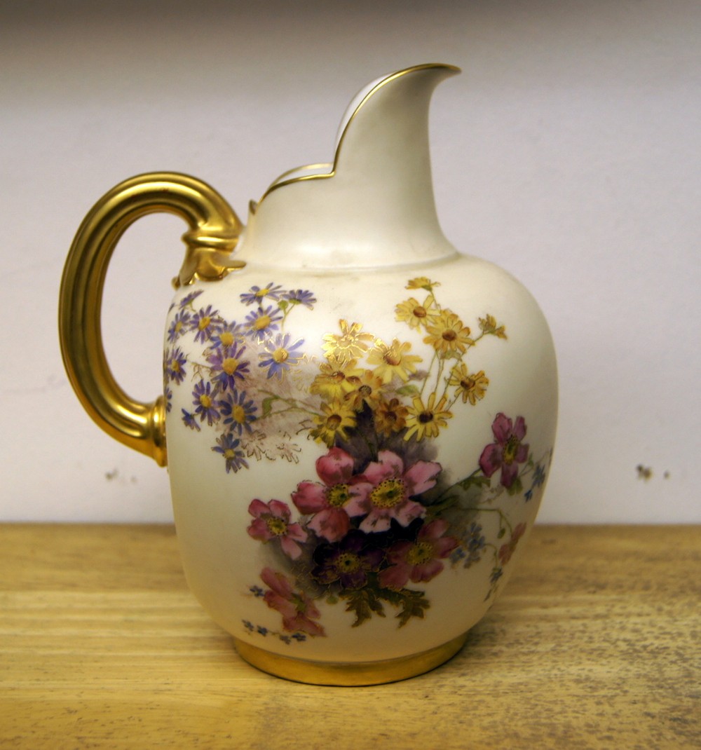 A good Royal Worcester flat back blush ivory jug