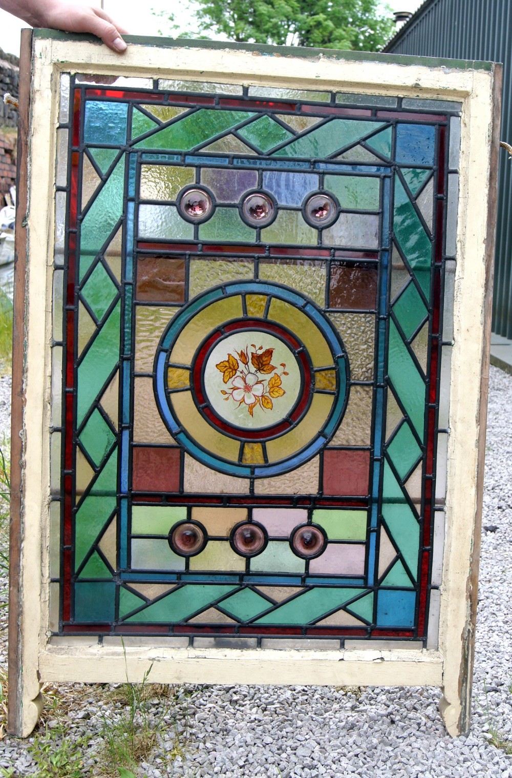 A very good large leaded and painted flower window