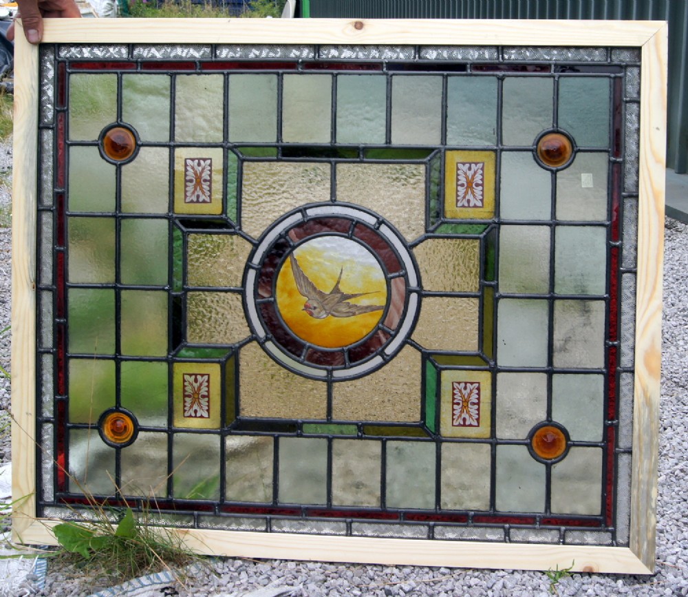 A very good painted and leaded glass bird window