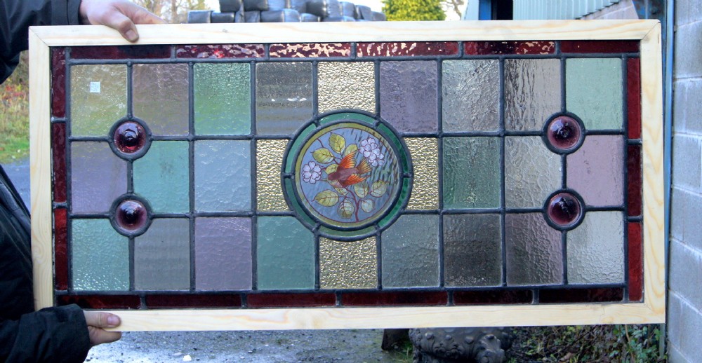 A stunning Victorian stained glass bird window
