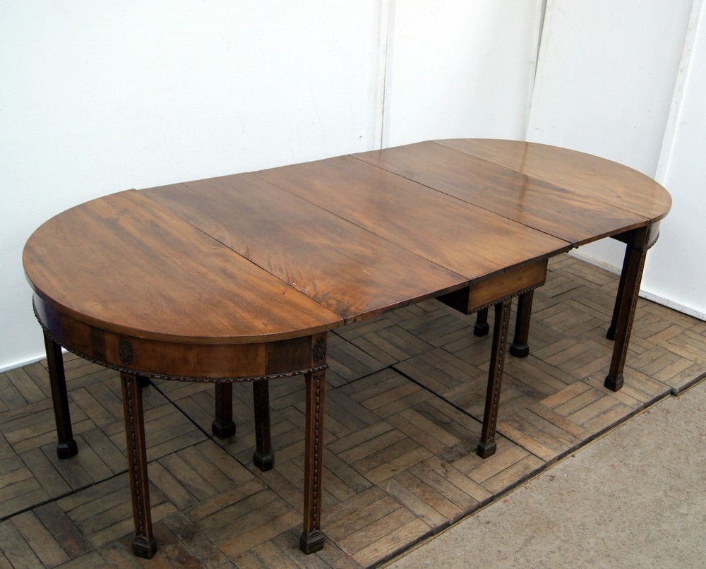 A very rare and unusual model of a George 111 mahogany D end gateleg dining table