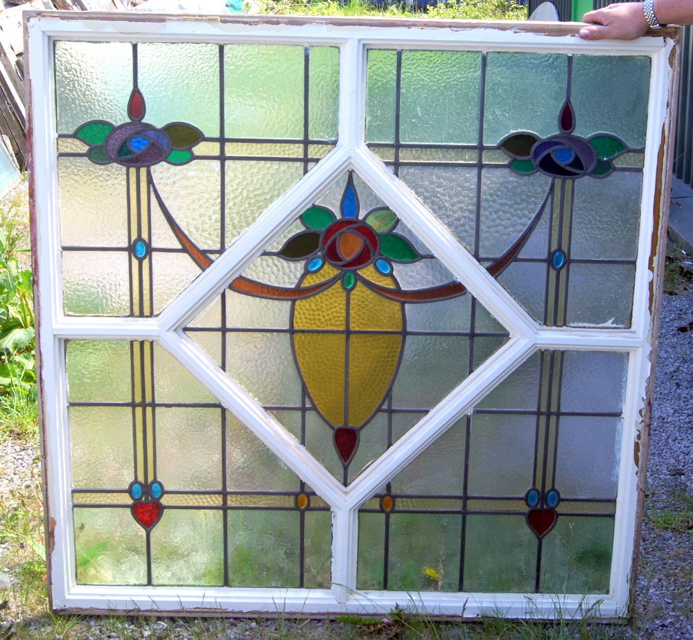 A large colourful, vibrant stained glass window