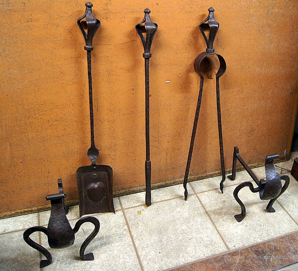 A superb arts and crafts hammered steel hand tools set