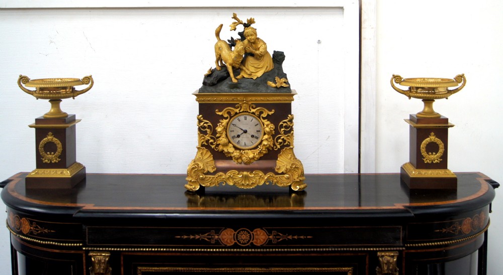 A gilt bronze and brown patinated 3 piece 19th century French clock set 