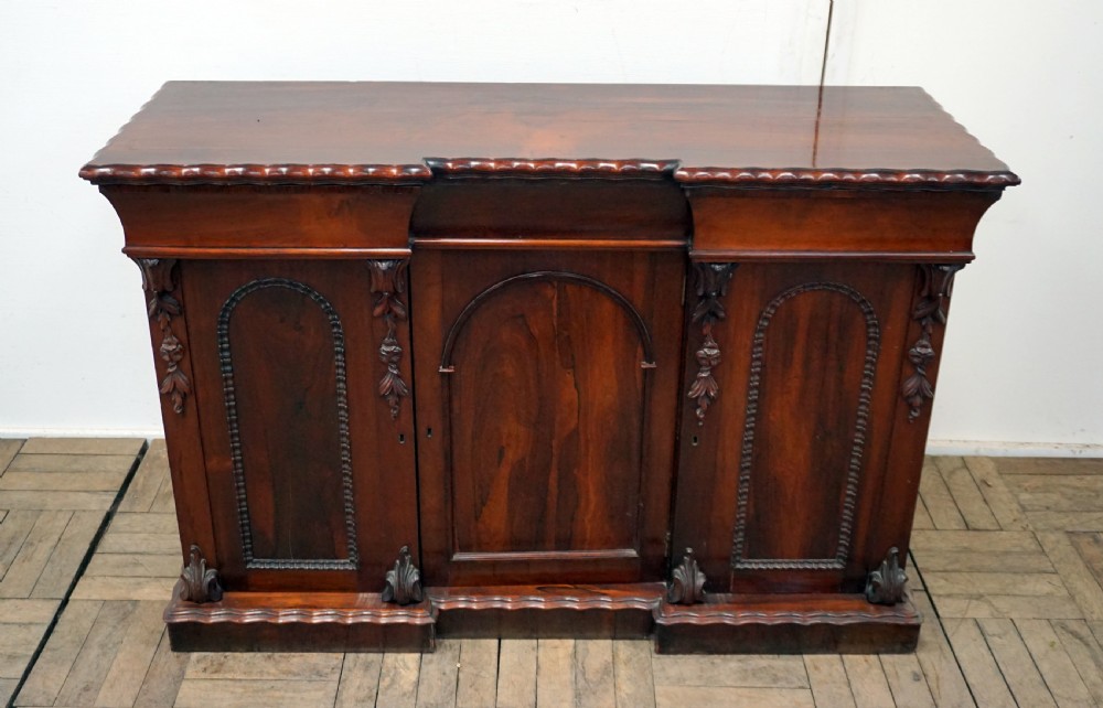 A petite rosewood inverted breakfront chiffonier  View III