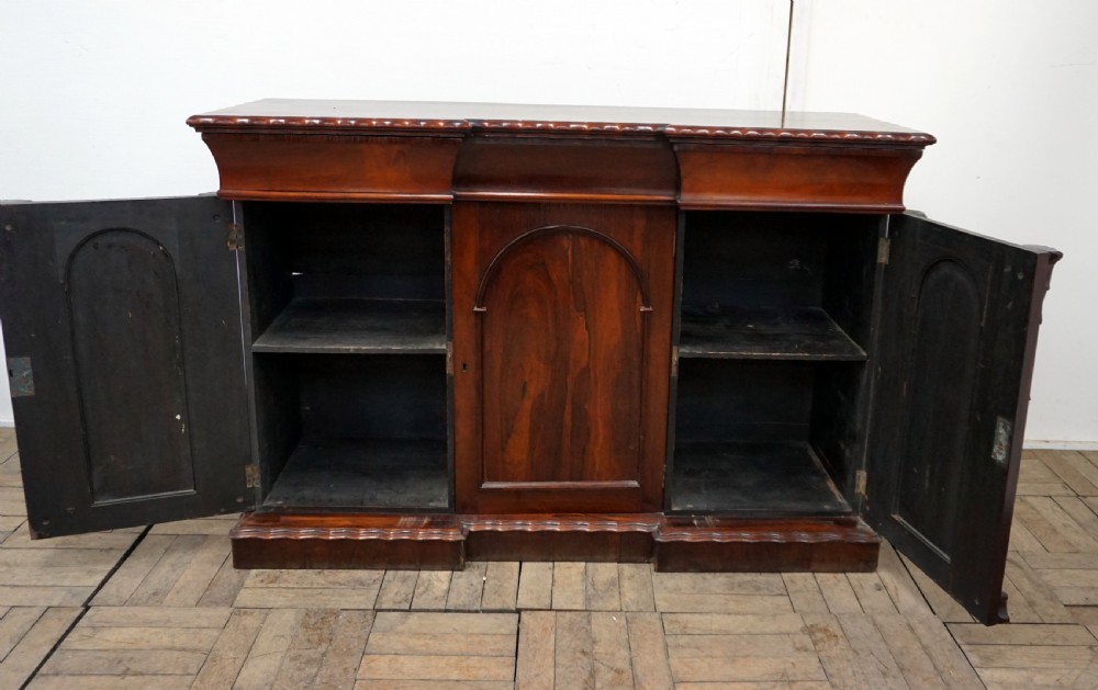 A petite rosewood inverted breakfront chiffonier  View IV