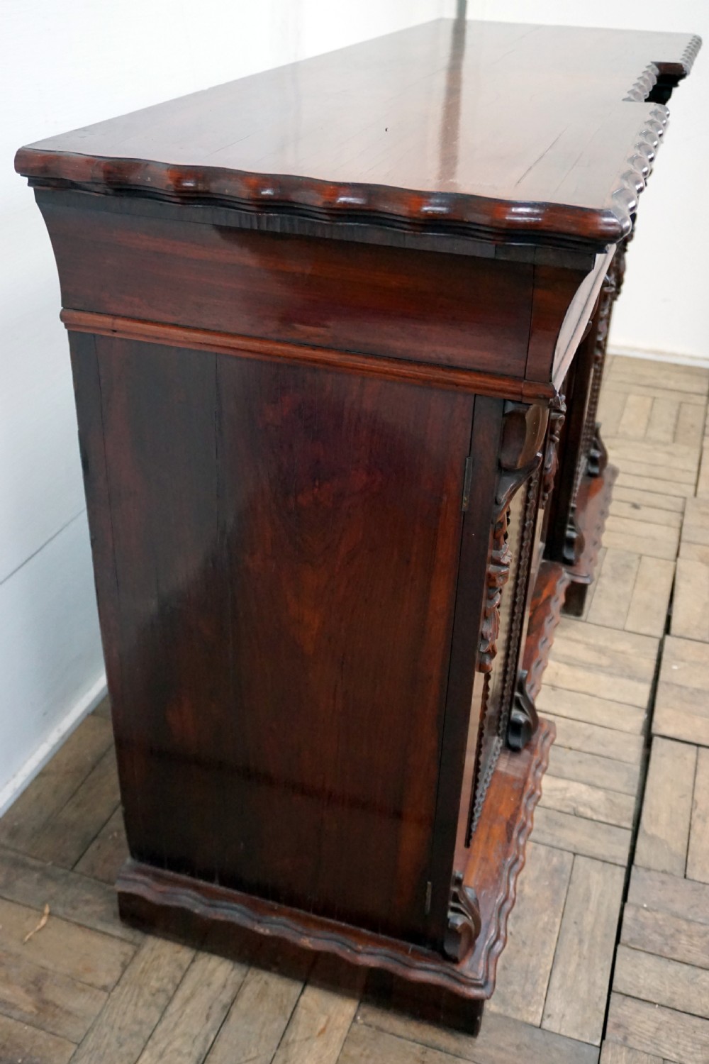 A petite rosewood inverted breakfront chiffonier  View V