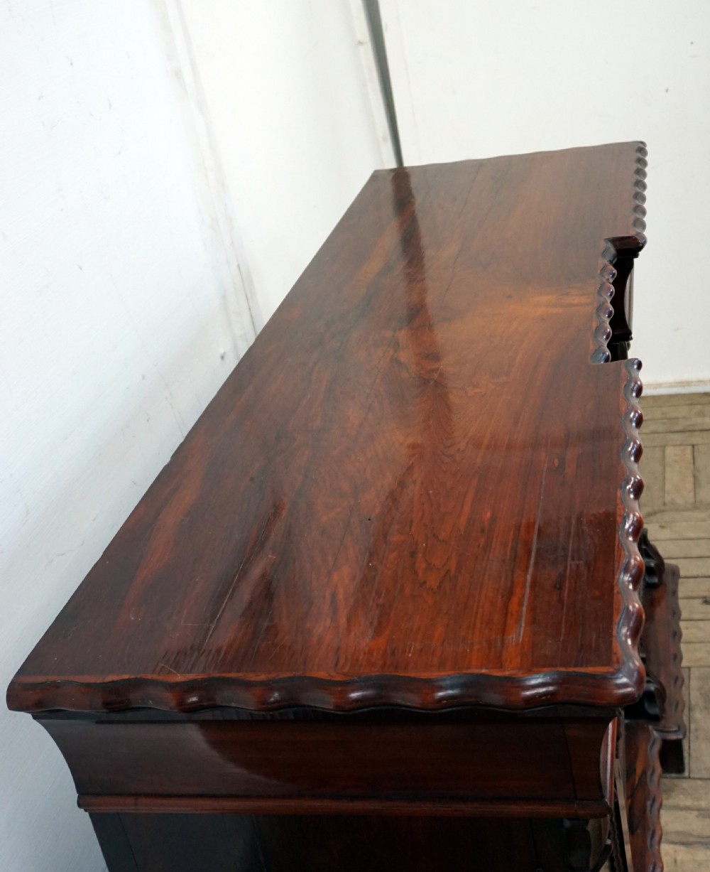 A petite rosewood inverted breakfront chiffonier  View VI