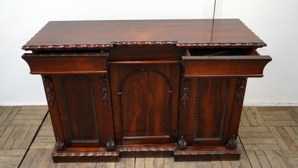 A petite rosewood inverted breakfront chiffonier  View VIII