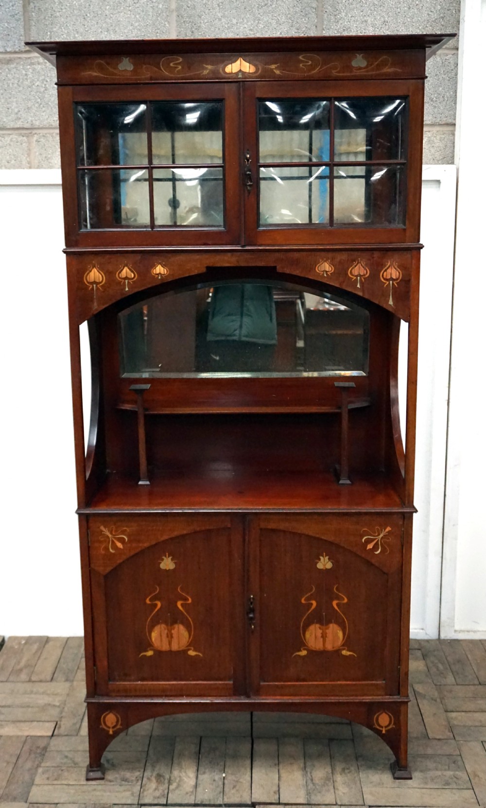 A very good art nouveau inlaid Scottish school cabinet