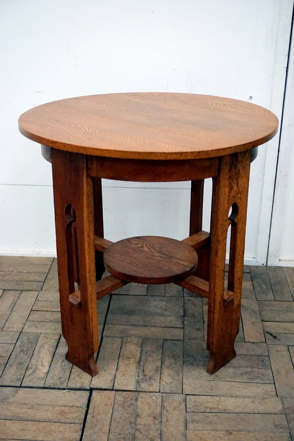 A good solid oak arts and crafts circular occasional table