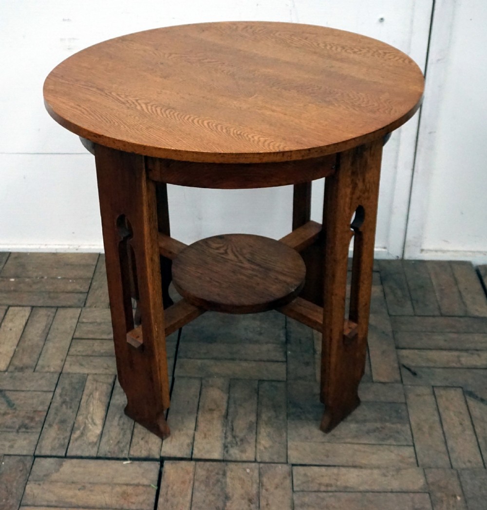 A good solid oak arts and crafts circular occasional table View IV