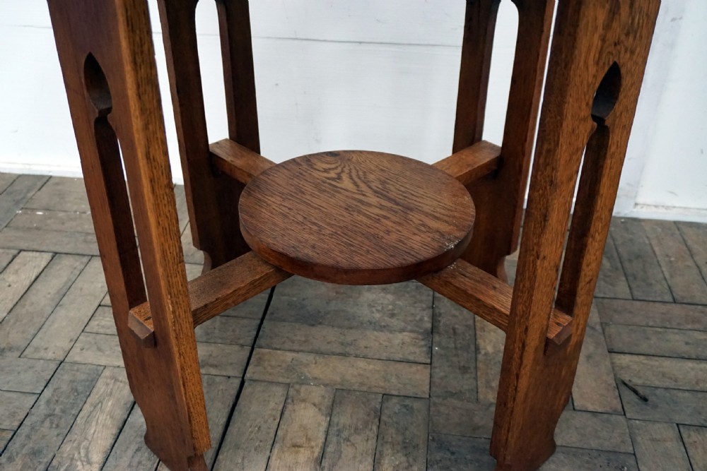 A good solid oak arts and crafts circular occasional table View V