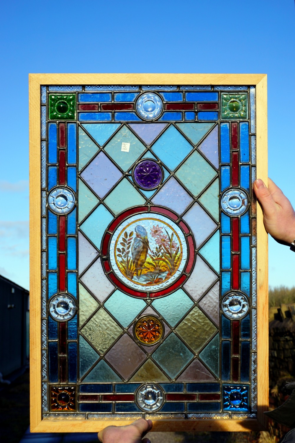 A fantastic painted leaded glass bird window