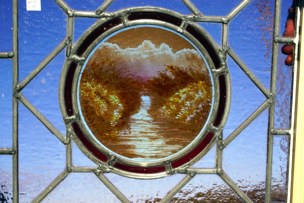 A good painted leaded window of a river  View II