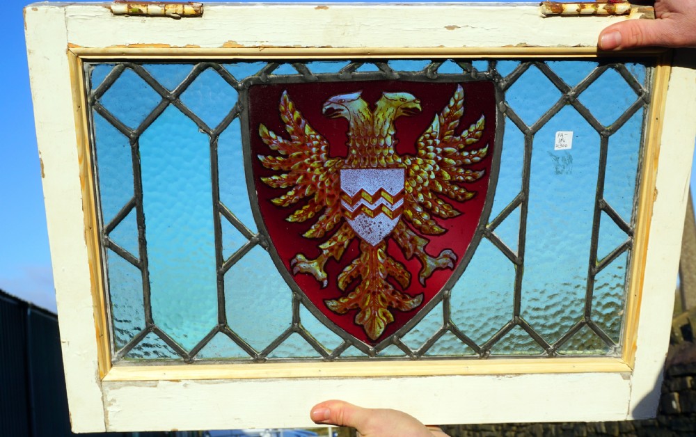 A good painted window of a double headed eagle in a shield