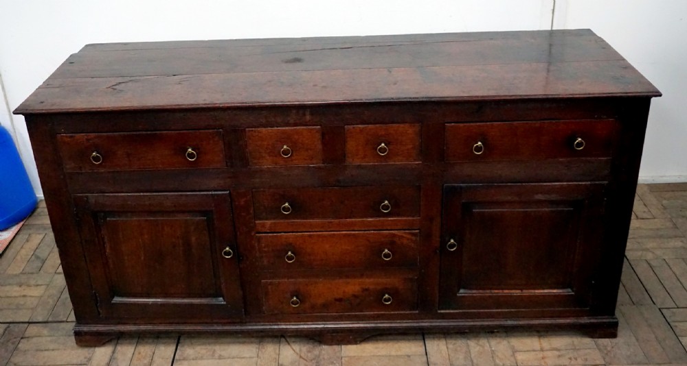 An amazing early 18th century oak dresser baser  View II